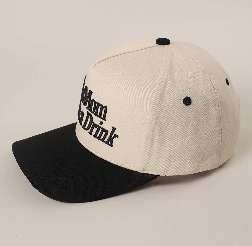 A baseball cap with an off-white crown and a black curved brim, featuring the text 'Don't Mom Make You Drink' embroidered in black on the front panel.