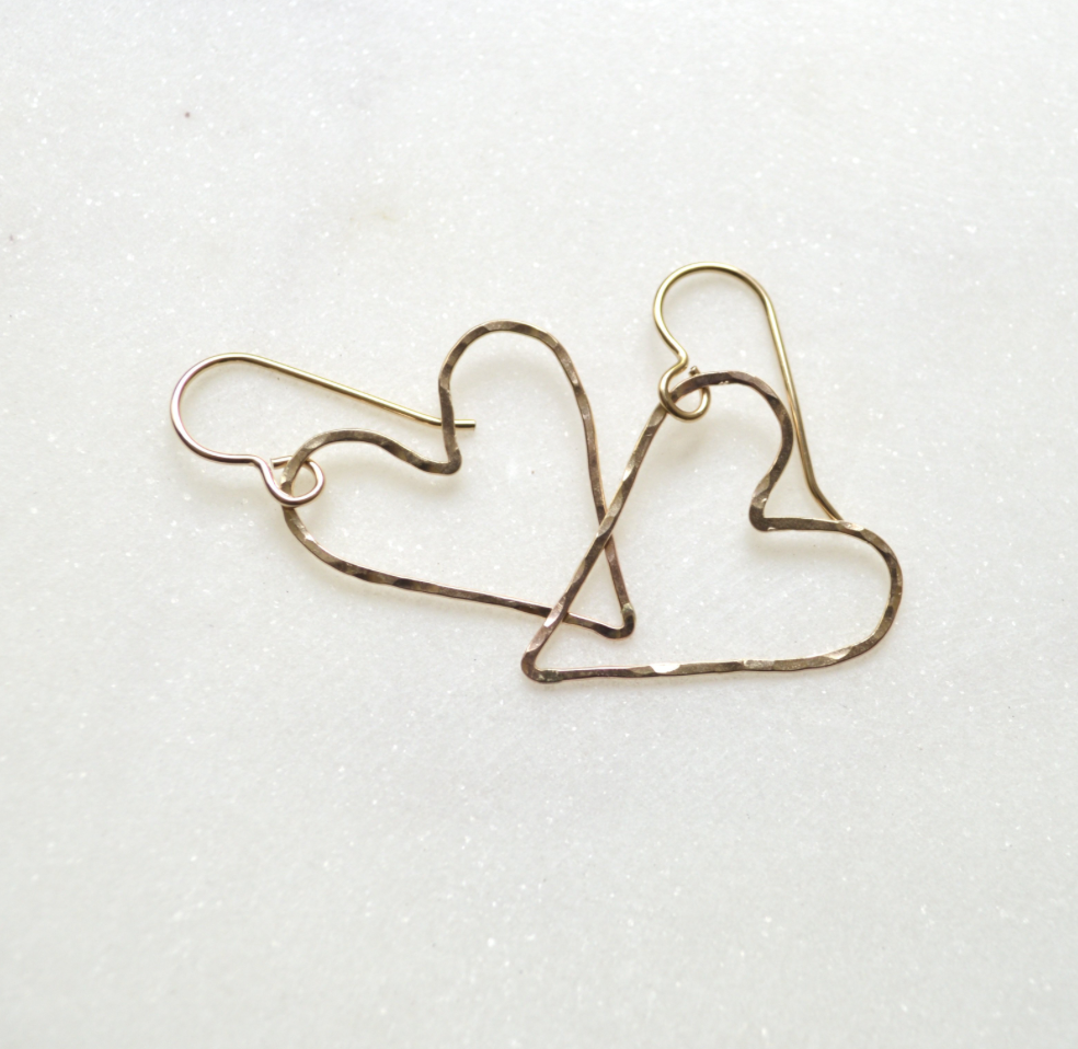 Heart-shaped earrings on a white background