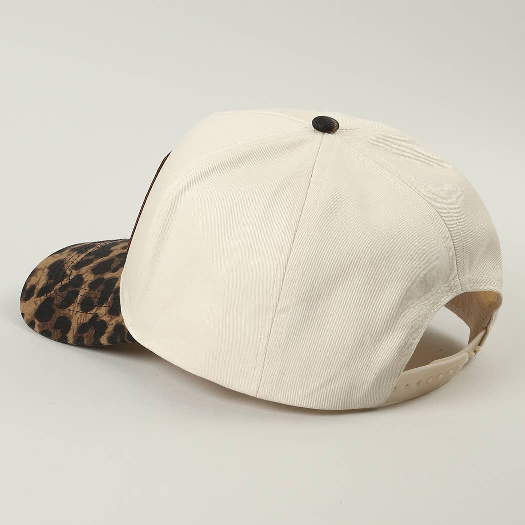 Beige baseball cap with leopard print visor on a light gray background