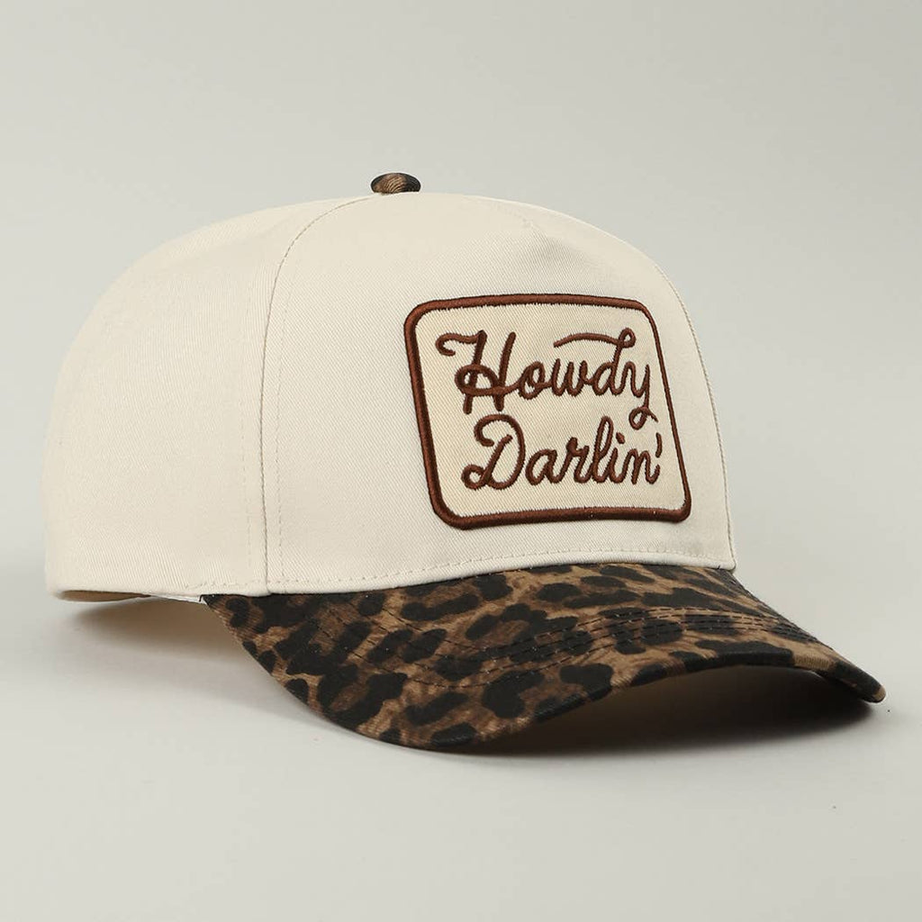 Cap with 'Howdy Darlin' logo and leopard print brim on a light gray background