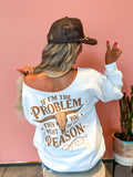 White off shoulder graphic sweatshirt with "if I'm the problem then you might be the reason" design