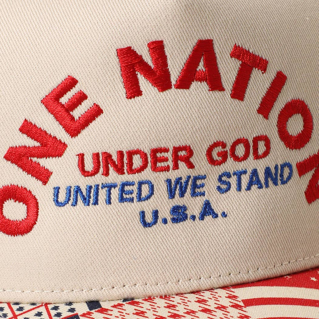 Cap with 'One Nation Under God United We Stand U.S.A.' text in red and blue on beige background