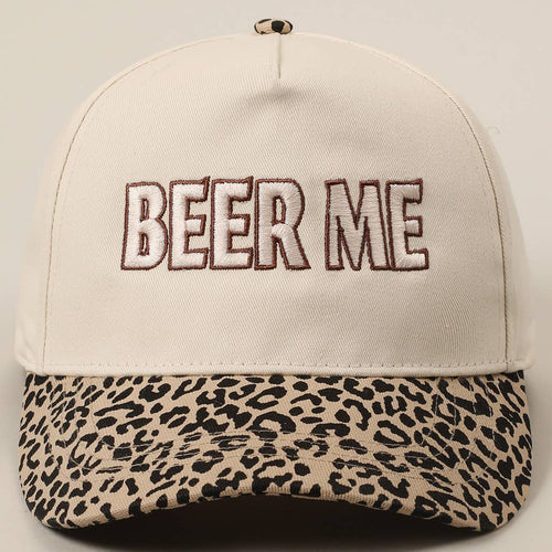 Beige cap with leopard print brim and 'BEER ME' text on a light gray background