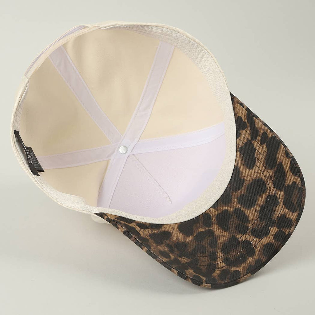 Leopard print cap on a light gray background