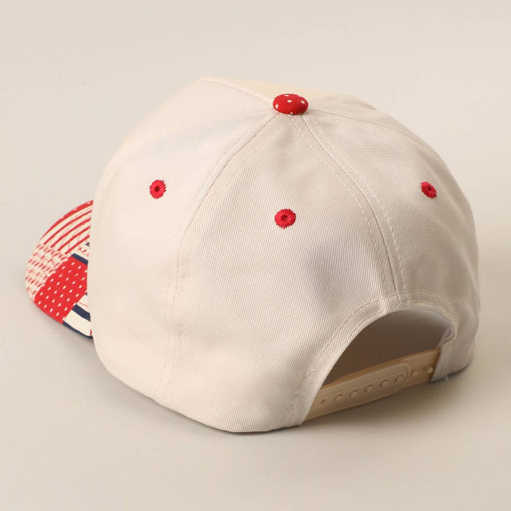 Beige baseball cap with red accents on a beige background